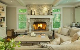 Living Room with Large Stone Fireplace and Mantel by Lake Country Builders