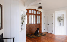 Home Entryway with White Wood Panel Walls