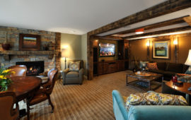 Lower Level Entertainment Area with Built-Ins and Rustic Wood Trim
