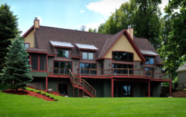 Home Exterior Gray and Tan Siding with Dark Red Trim