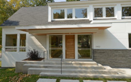 White Home Exterior with Wood Door